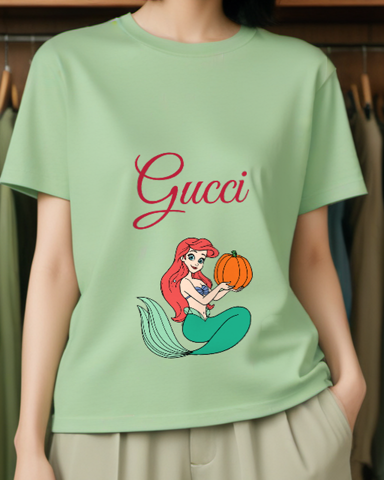 Sage Green Ariel Mermaid Holding Pumpkin Graphic T-Shirt - model wearing view